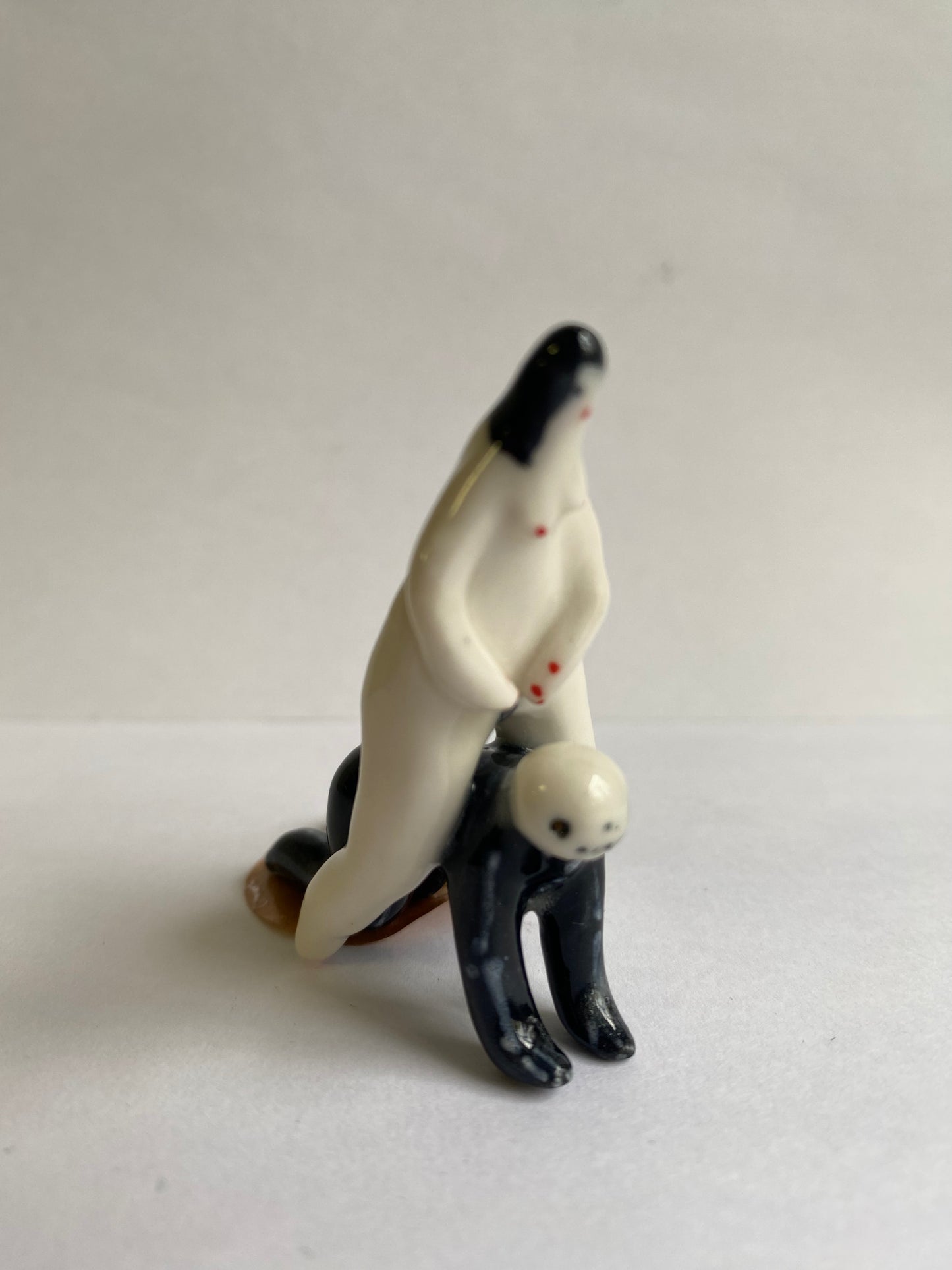 Porcelaine tiny lady and skeleton by Rebecca Edelmann Ceramics