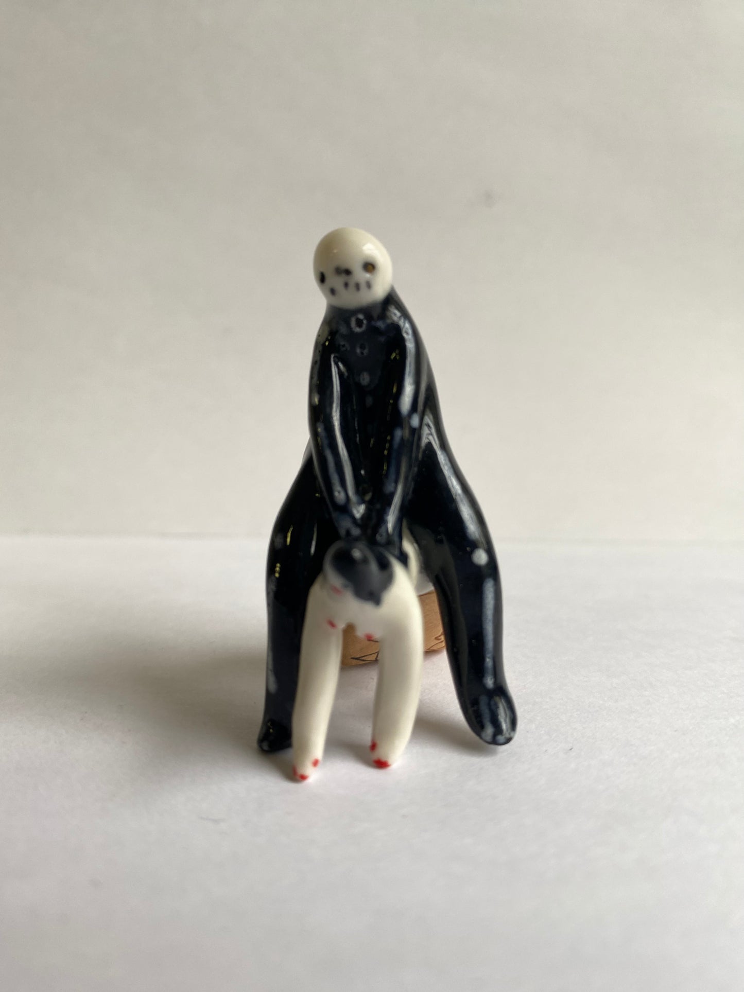 Porcelaine tiny skeleton and lady by Rebecca Edelmann Ceramics