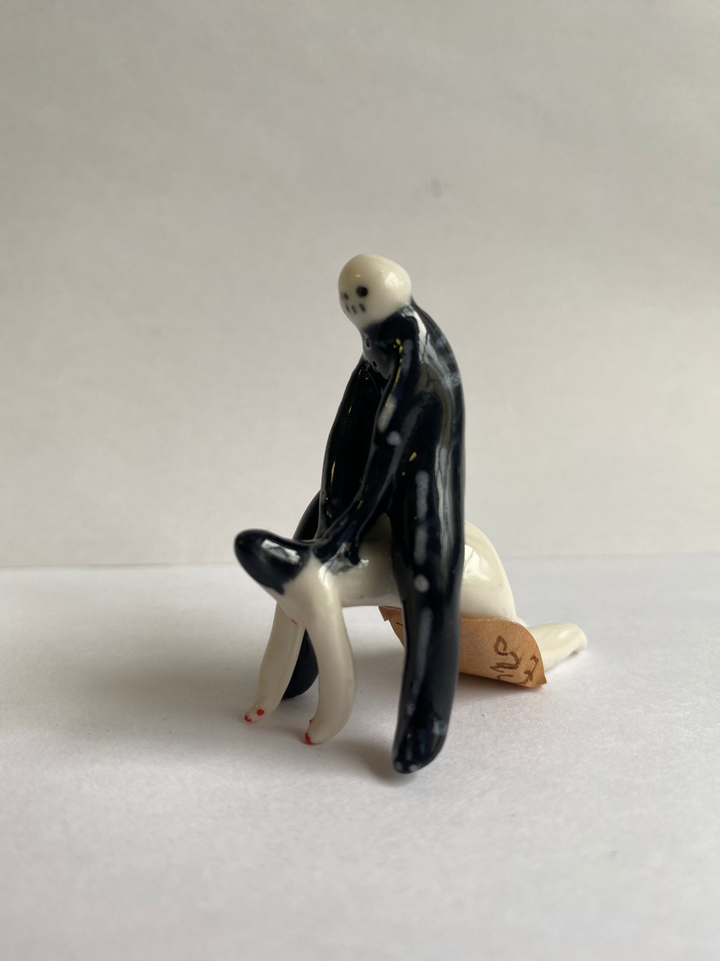 Porcelaine tiny skeleton and lady by Rebecca Edelmann Ceramics