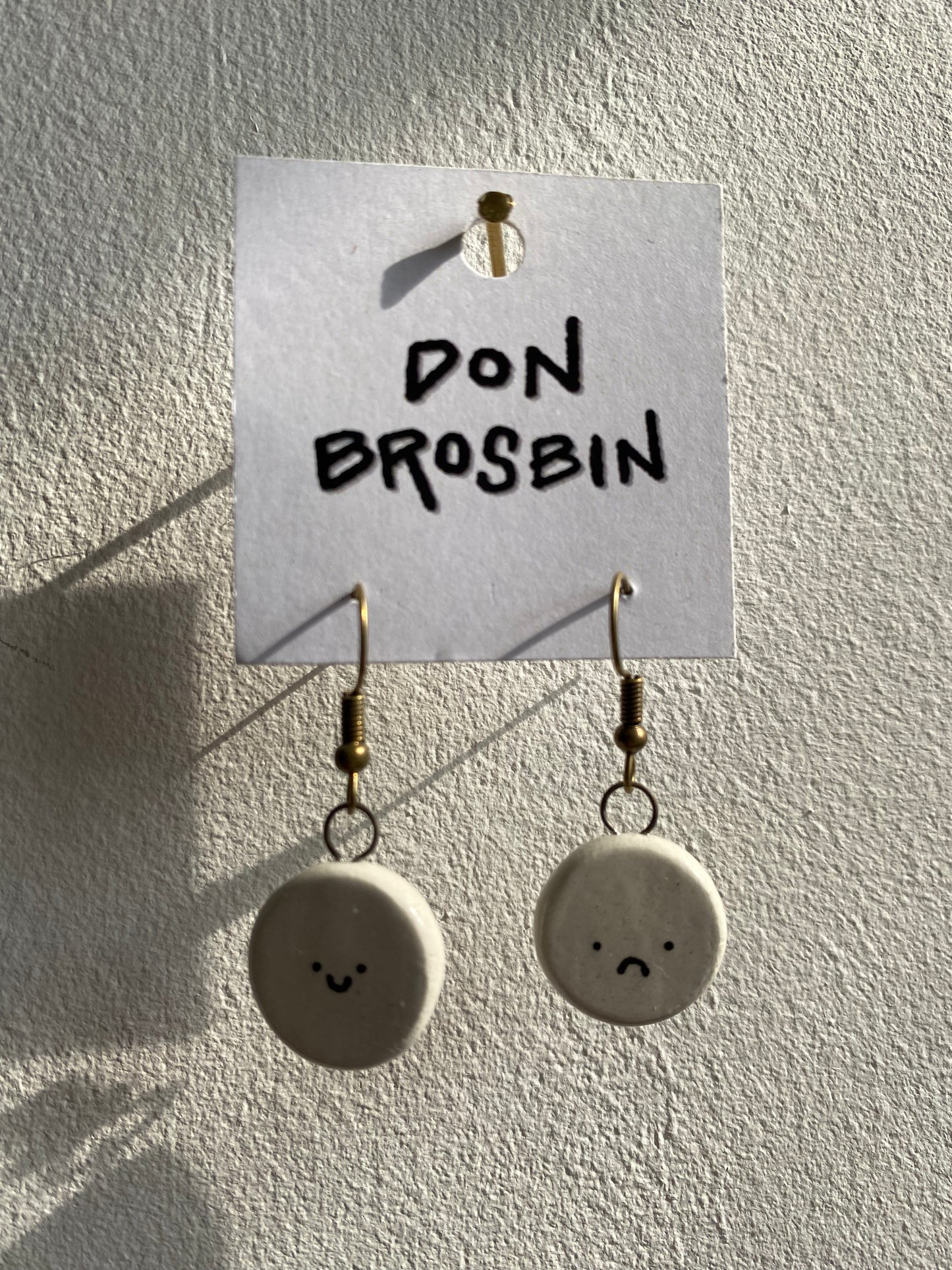 Happy Sad Faces handmade ceramic earrings by Don Brosbin