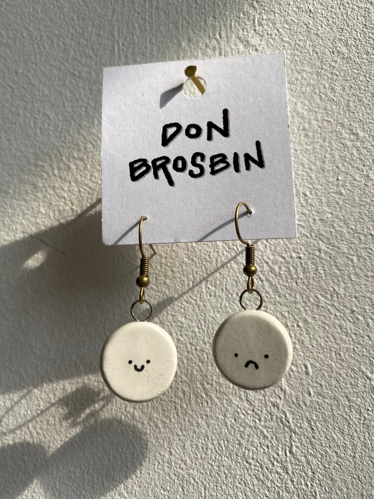 Happy Sad Faces handmade ceramic earrings by Don Brosbin