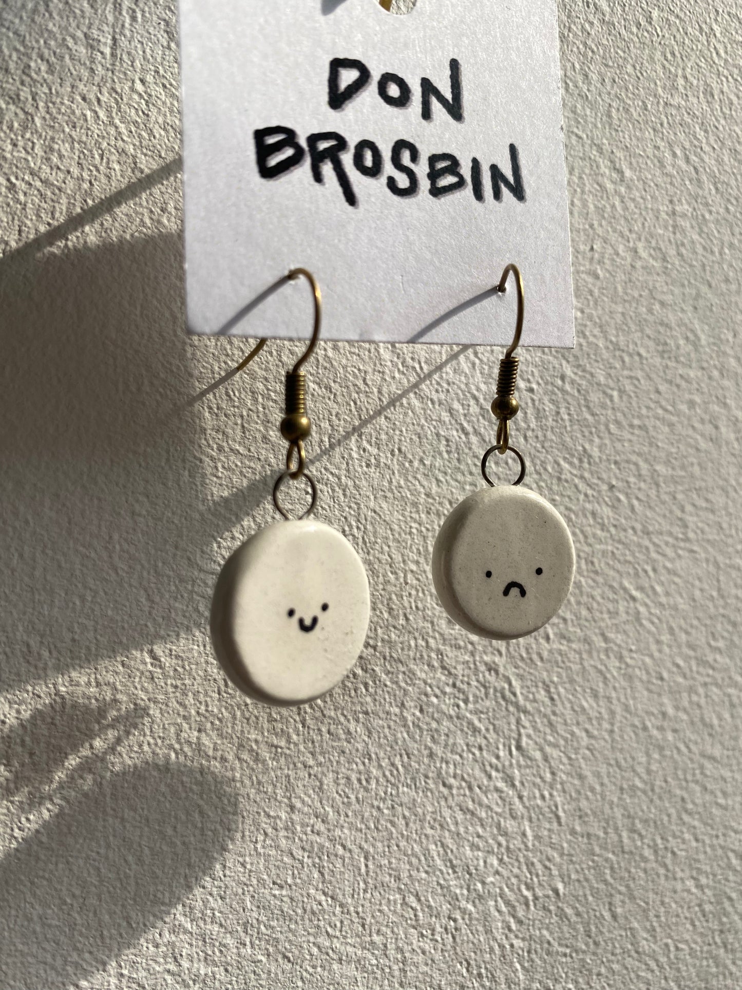 Happy Sad Faces handmade ceramic earrings by Don Brosbin