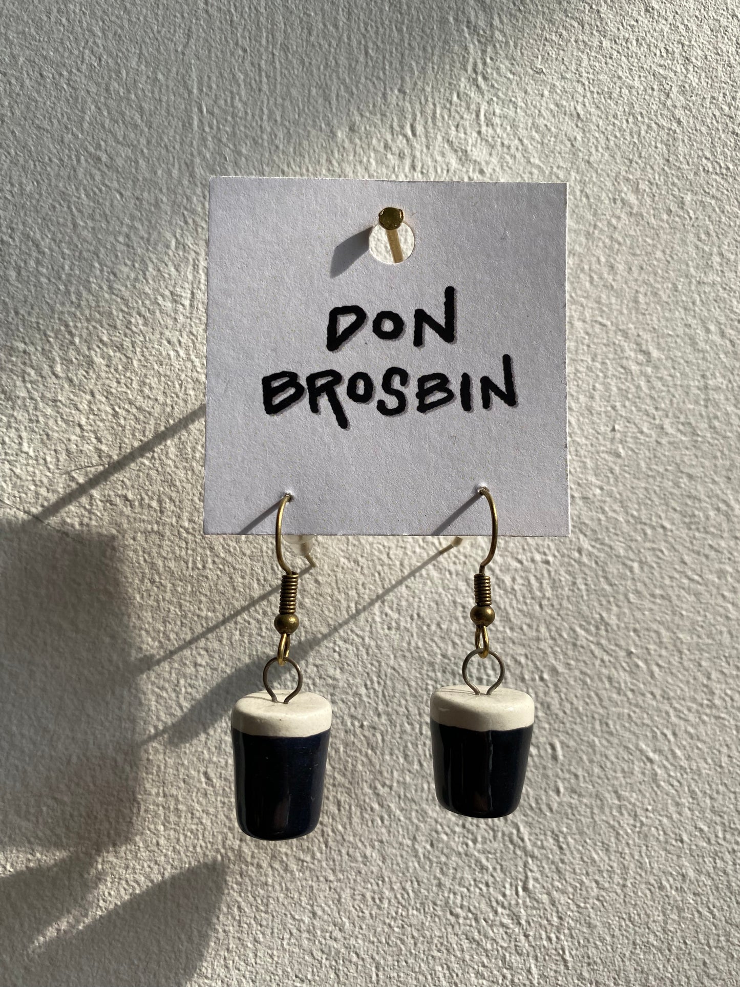 Guinness handmade ceramic earrings by Don Brosbin