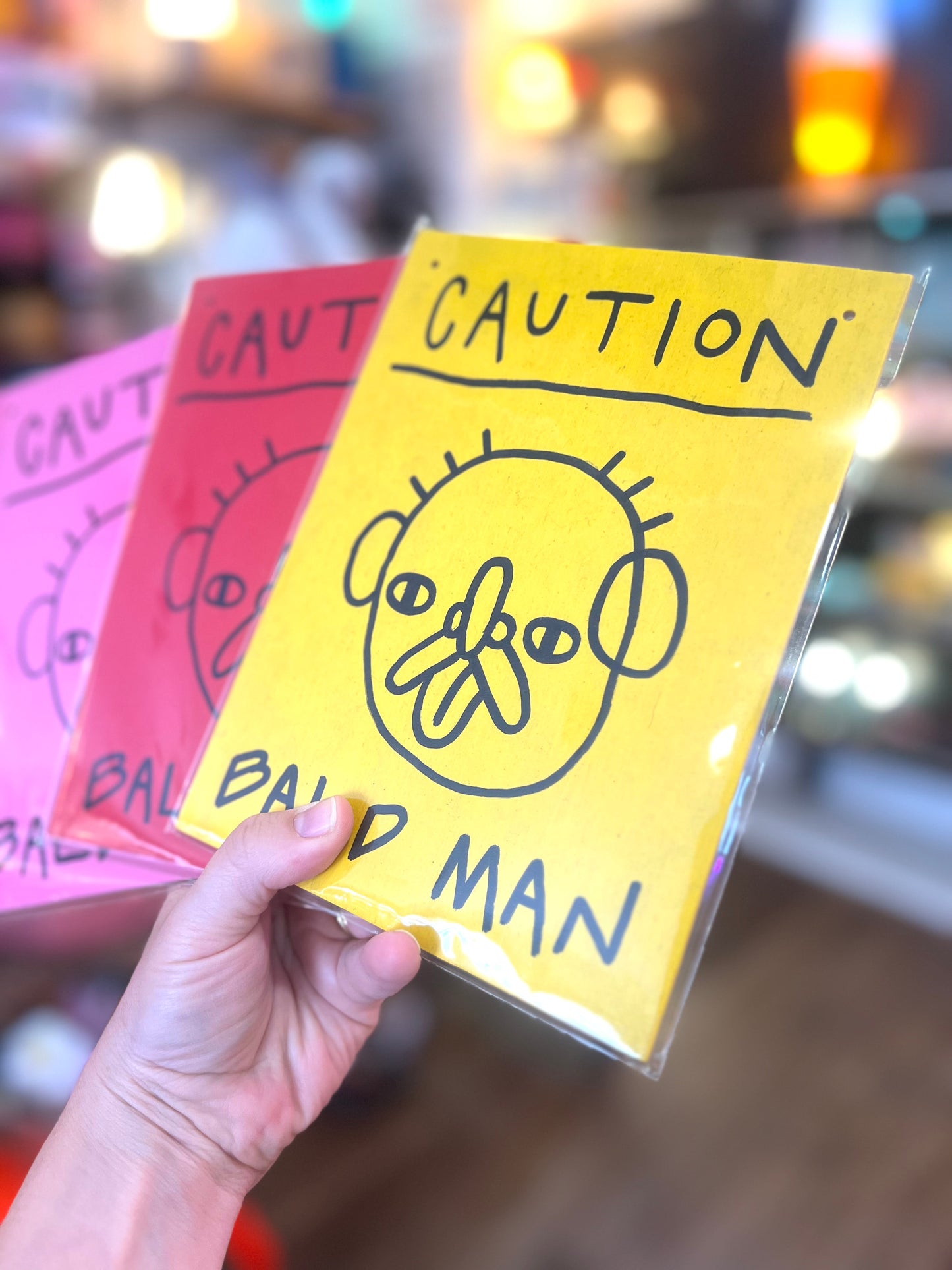 'Caution, Bald Man' Wooden Board Wall Art by Don Brosbin