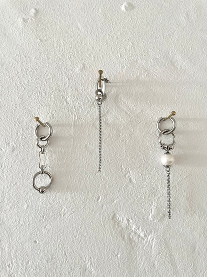Mixmatched Santa Luna earrings  by Eloy Sant