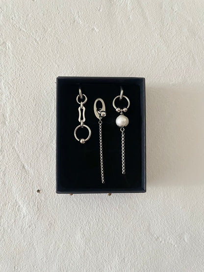 Mixmatched Santa Luna earrings  by Eloy Sant