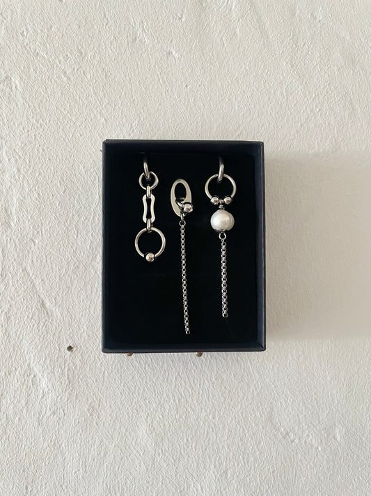 Mixmatched Santa Luna earrings  by Eloy Sant