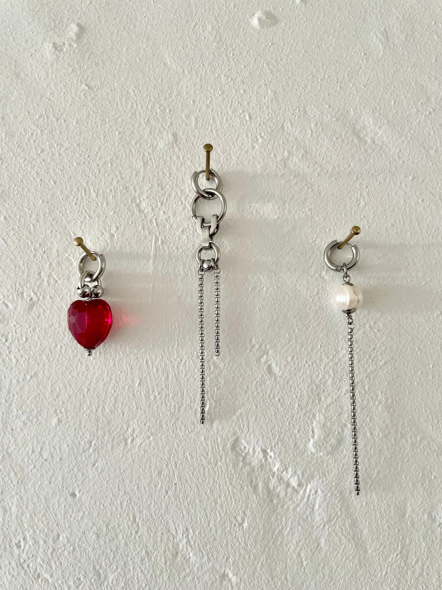 Mixmatched Santa Puso earrings  by Eloy Sant