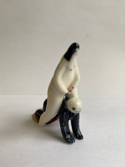 Porcelaine tiny lady and skeleton by Rebecca Edelmann Ceramics