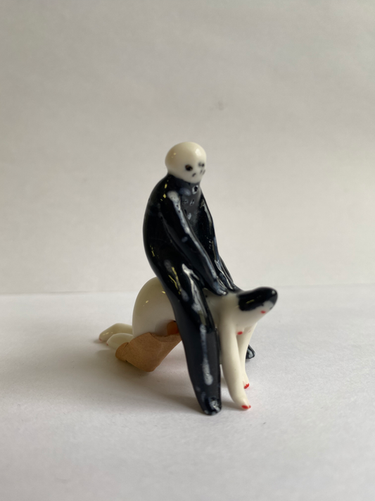 Porcelaine tiny skeleton and lady by Rebecca Edelmann Ceramics