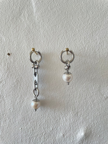 mixmatched repurposed stainless steel hardware earrings by Eloy Santos