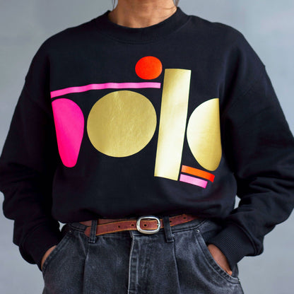 neon pink and gold tag on black sweatshirt - women’s fit by Touch Press Studio