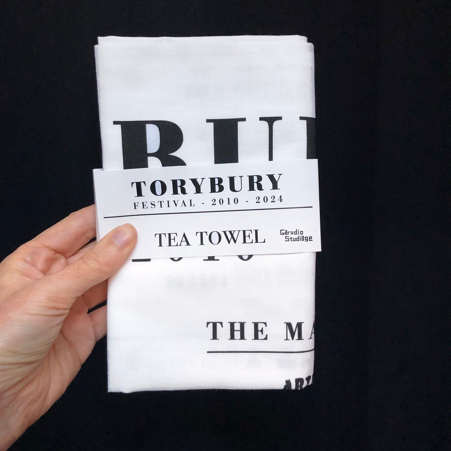 Torybury Festival Tea Towel by Garudio