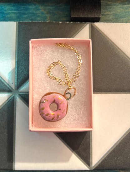 Porcelain doughnut pendant with gold rim by REBECCA EDELMANN