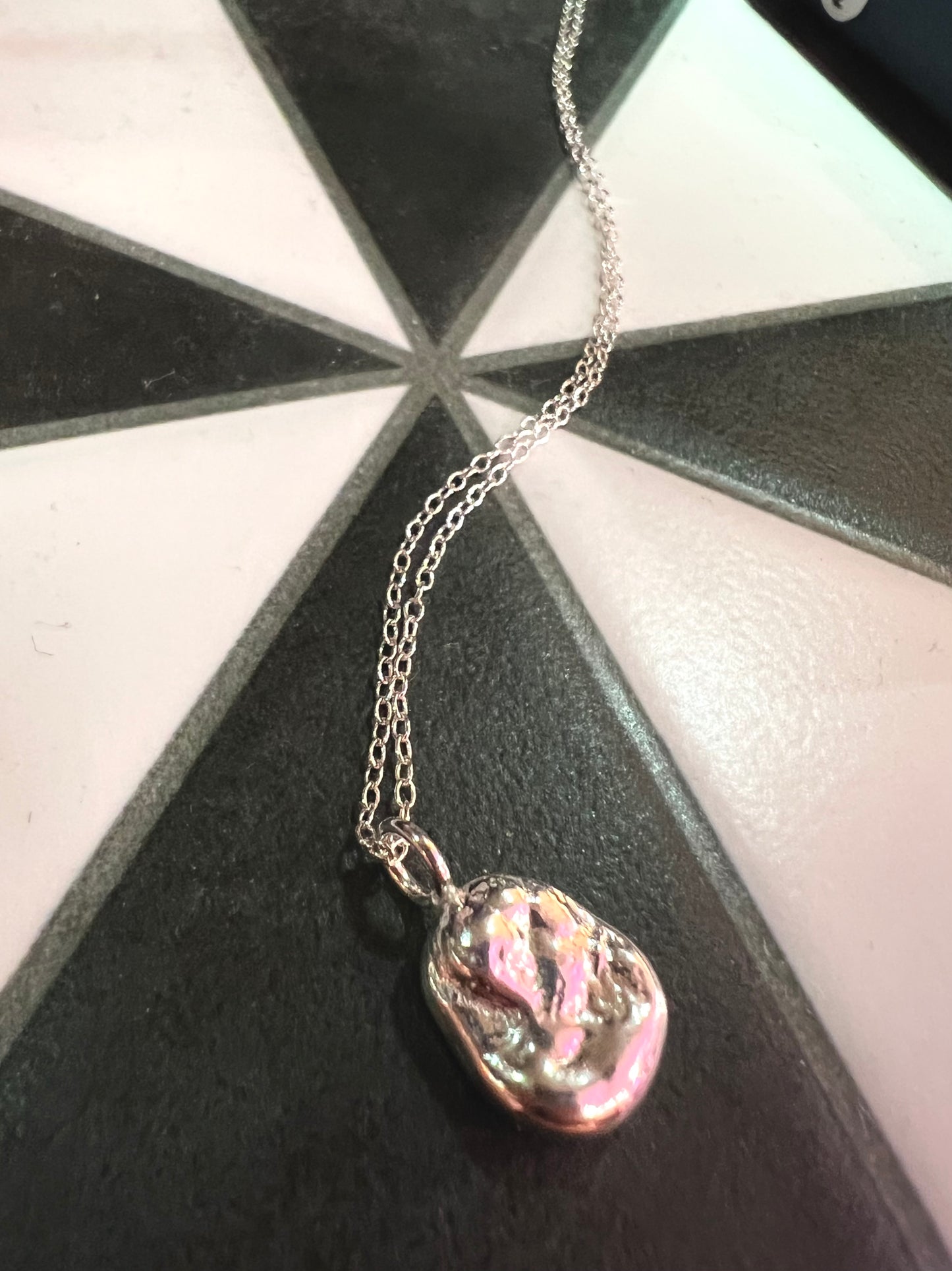 Silver Pendant With Chain By Thea Wates.