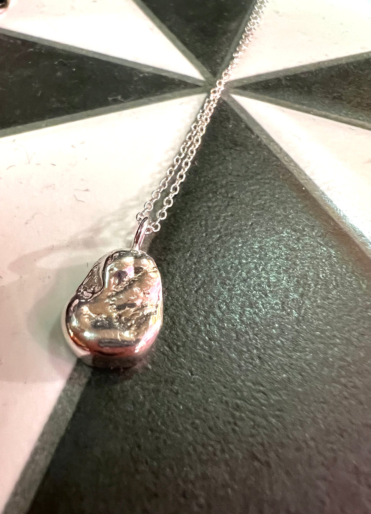 Silver Pendant With Chain By Thea Wates.